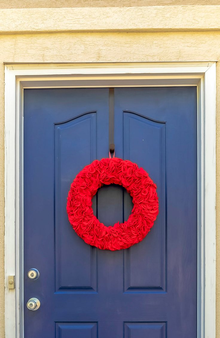 Get ruffled in all the right ways this 4th of July with this festive wreath made entirely of red felt. Here are some darling ideas for 4th of July DIY door wreaths. You will love them!