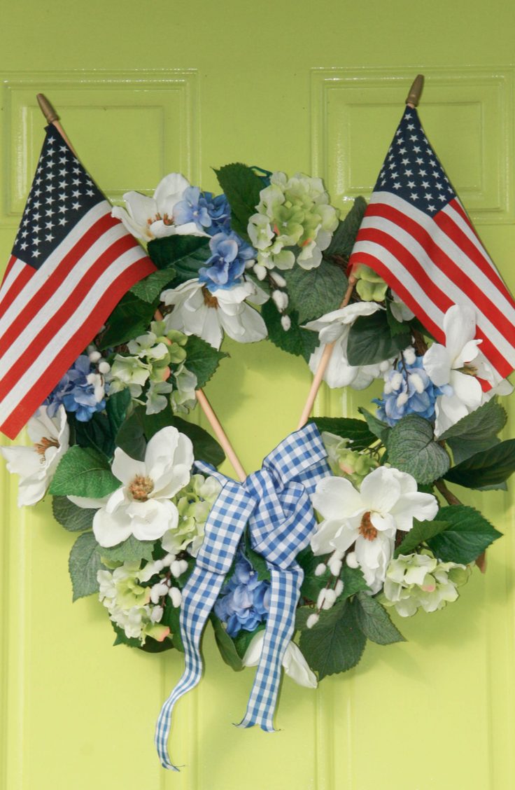 Add some pretty flowers to a basic green wreath to give your door some patriotic flower power. Here are some darling ideas for 4th of July DIY door wreaths. You will love them!